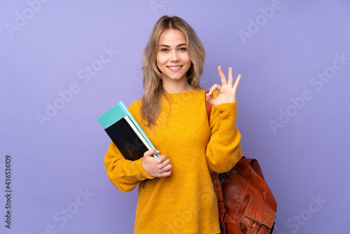 Teenager Russian student girl isolated on purple background in zen pose