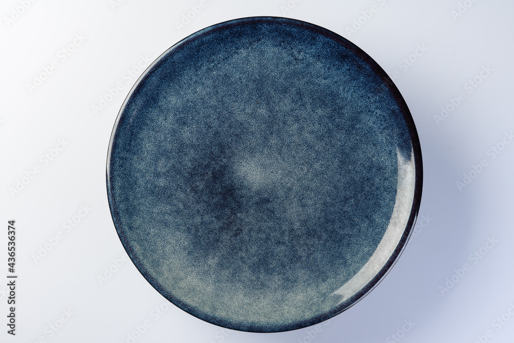 blue empty plate on a white background. Top view blue empty plate on a white background. Top view