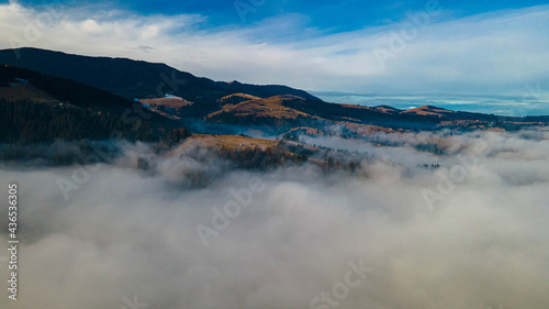 mountains tops high above clouds fog