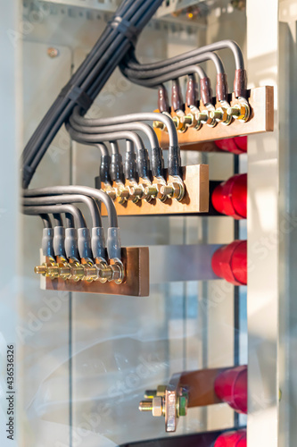 wire cable assemble or connect with copper busbar in electrical power cabinet for supply electric high power to production line or machine in manufacturing process industrial