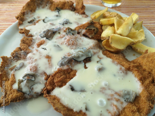 Milanese cutlet pork loin steak breaded and stuffed with cheese and truffle