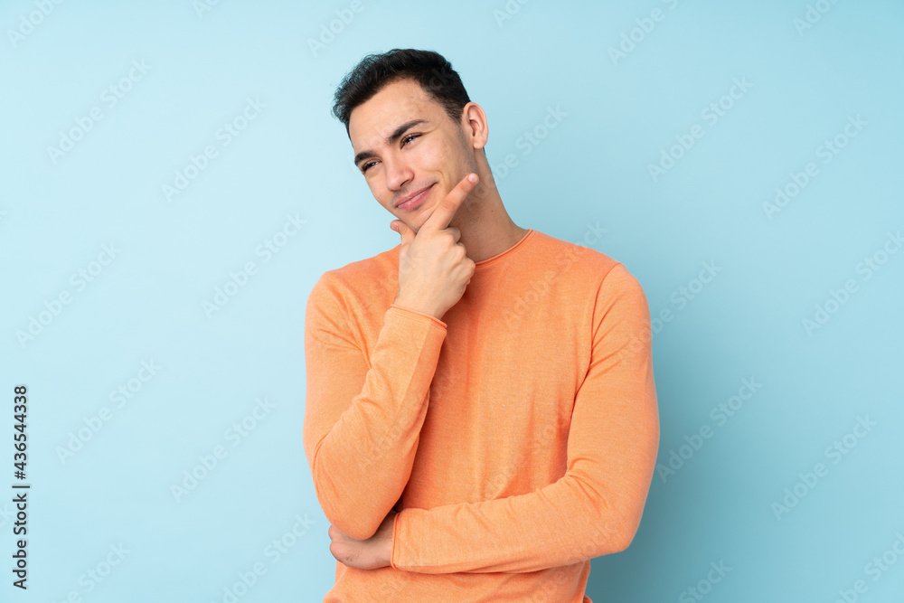 Young caucasian handsome man isolated on blue background smiling Young caucasian handsome man isolated on blue background smiling