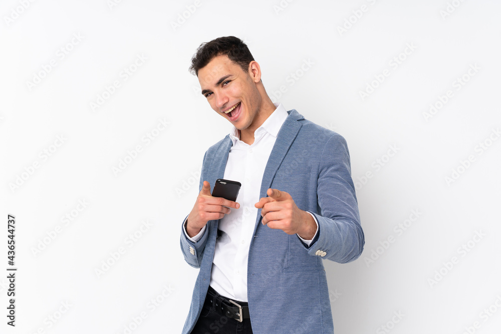 Young handsome businessman on isolated background pointing to the front and smiling Young handsome businessman on isolated background pointing to the front and smiling