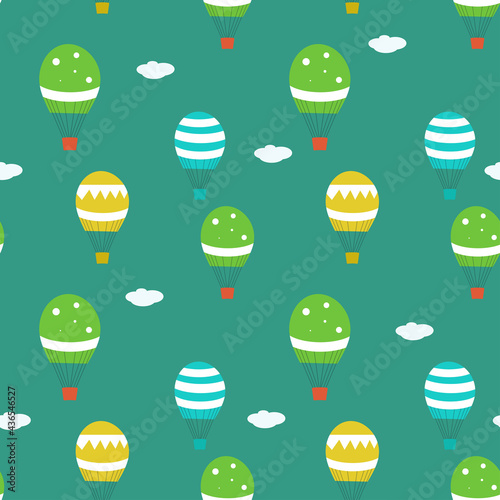 Seamless vector pattern with air balloons on green background. Modern concept for fabric and paper, surface textures.