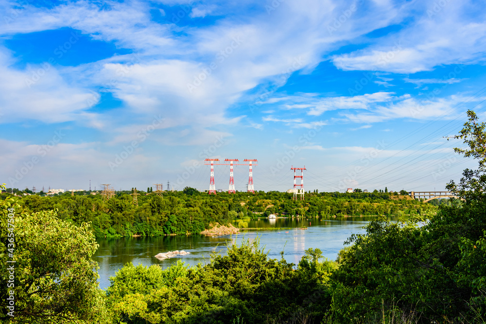 High voltage power lines across the river Dnieper in Zaporozhye city, Ukraine.