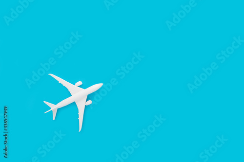 Airplane toy isolated on pastel blue background © Drpixel