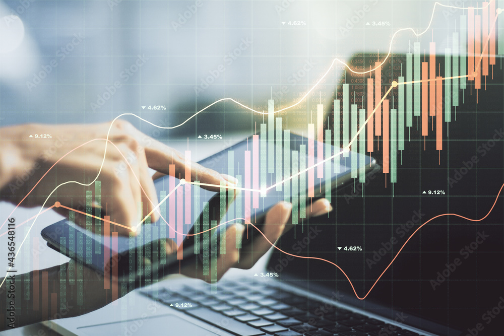 Multi exposure of abstract financial graph and hand working with a digital tablet on background, financial and trading concept