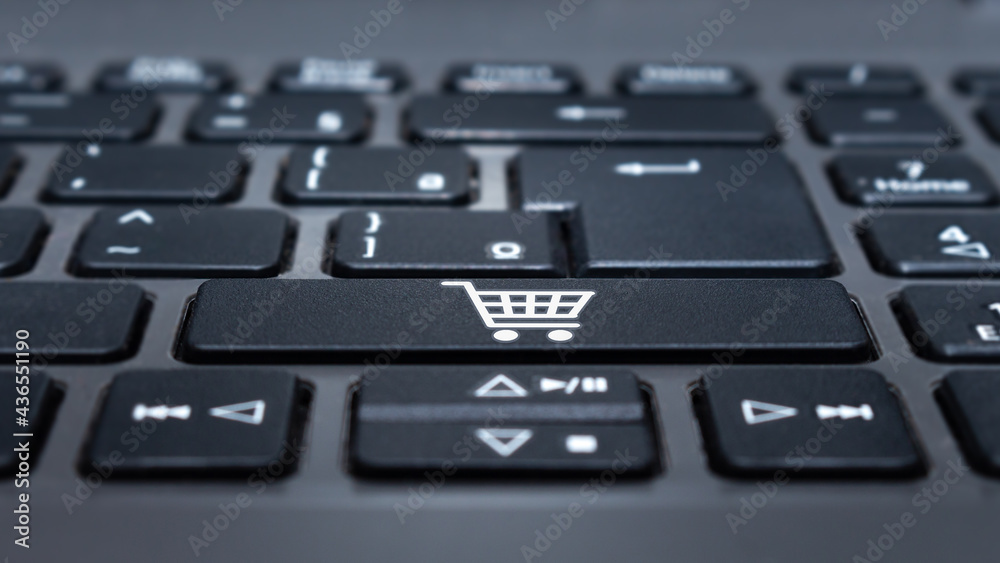 Key on laptop keyboard with shopping cart icon. Key on laptop keyboard with shopping cart icon.