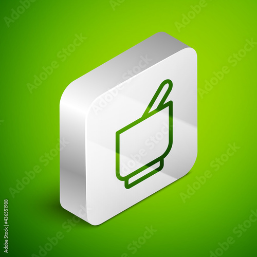 Isometric line Mortar and pestle icon isolated on green background. Silver square button. Vector