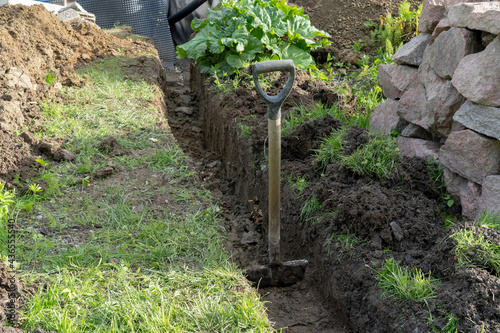 Digging ground to make drainage home.
