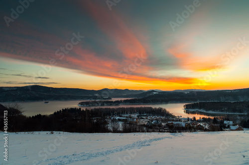 The January sunrise over Lake Solina seen from the viewpoint in Polańczyk. Polanczyk, Bieszczady Mountains.