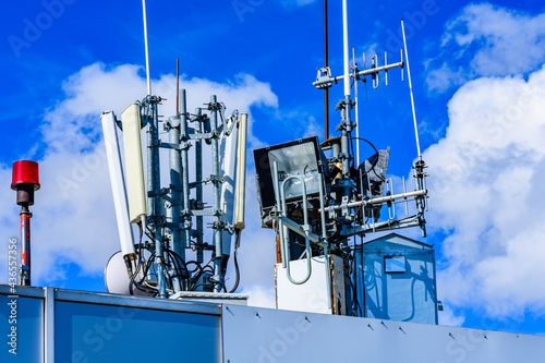 Telecommunication antennas and wireless communication antenna transmitter against the blue sky