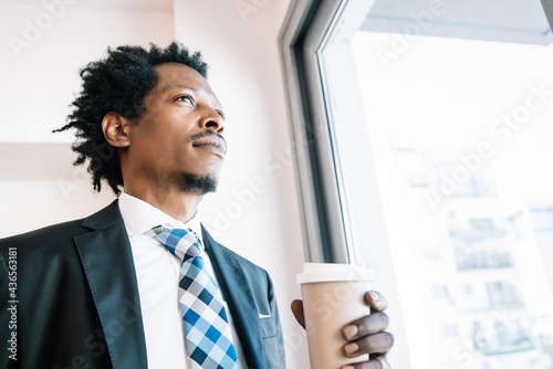 Businessman drinking coffee on a break from work.