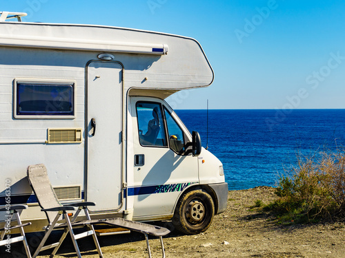 Rv camper camping on sea shore, Spain.