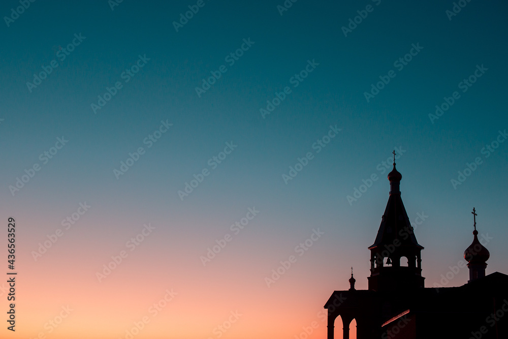 Church with domes silhouette, on a sunset background with free space for text (copy space).