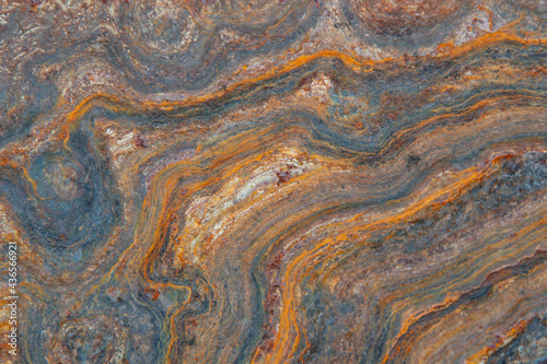 grunge background: curly rust on an old metal surface, toning