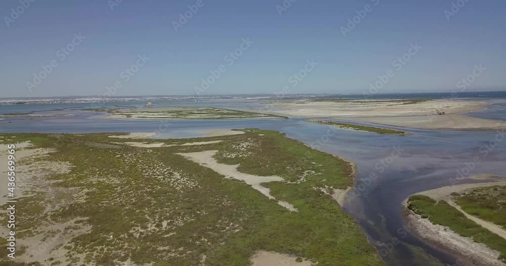 Small islands surrounded by low tide on the Mediterranean coast Small islands surrounded by low tide on the Mediterranean coast