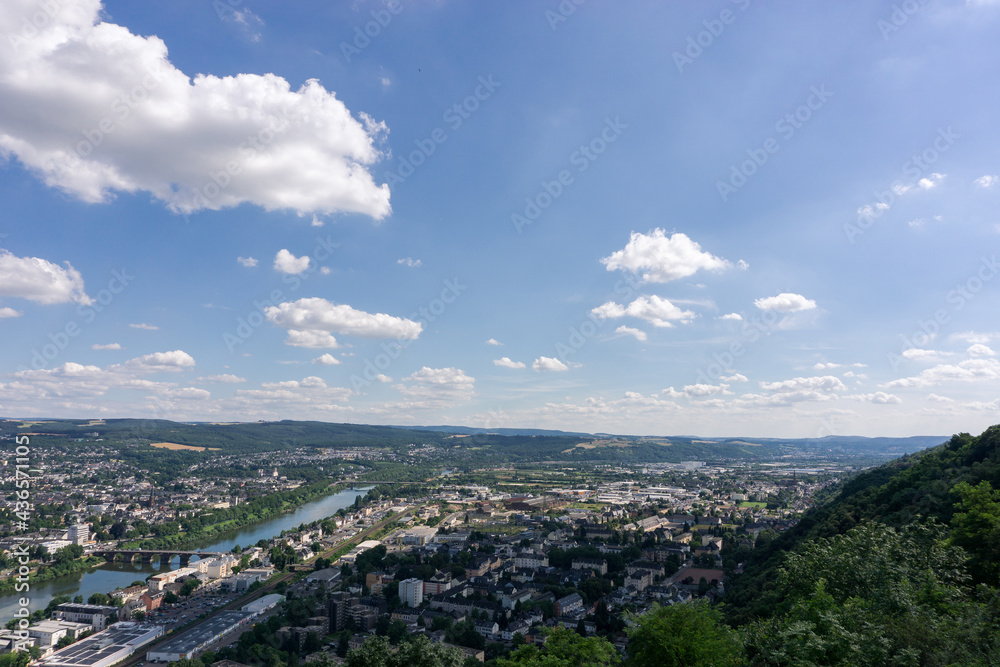 Aerial view of Trier on beautiful summer day with blue sky and clouds over Moselle river from viewpoint Marian column, Germany
