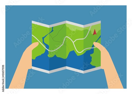 Hand holding a map sheet.