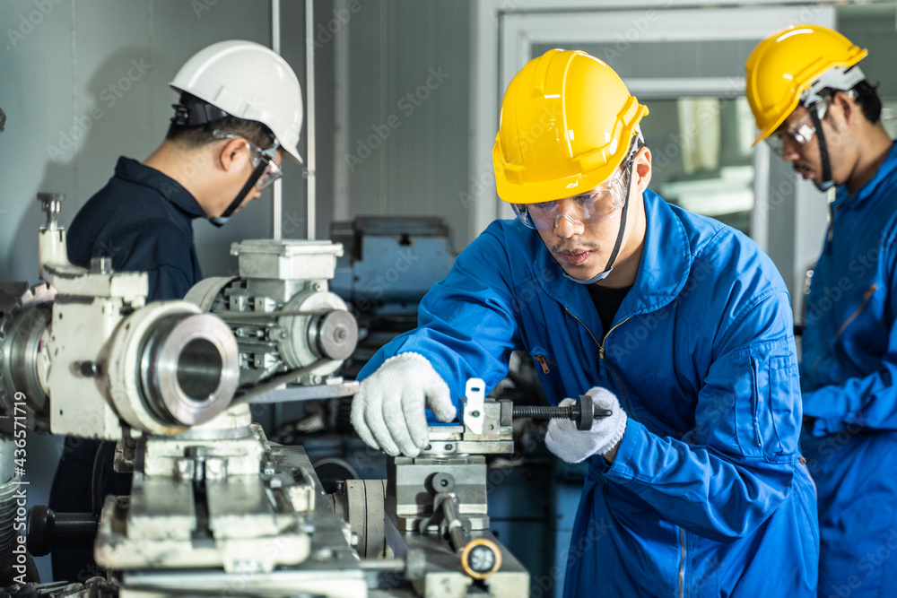 Mechanical technician industrial worker team work on milling machine Mechanical technician industrial worker team work on milling machine