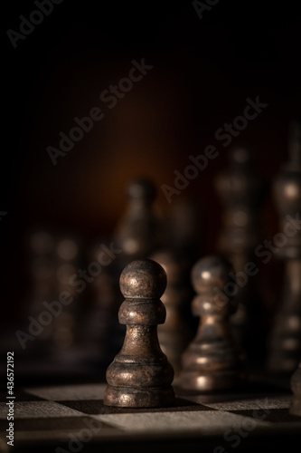 Close up of chess pieces on a chess board.