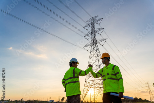 Wallpaper Mural Team work of Engineers and Technician join hands for success after work inspections at the electric power station, electricity high voltage electric transmission tower Torontodigital.ca