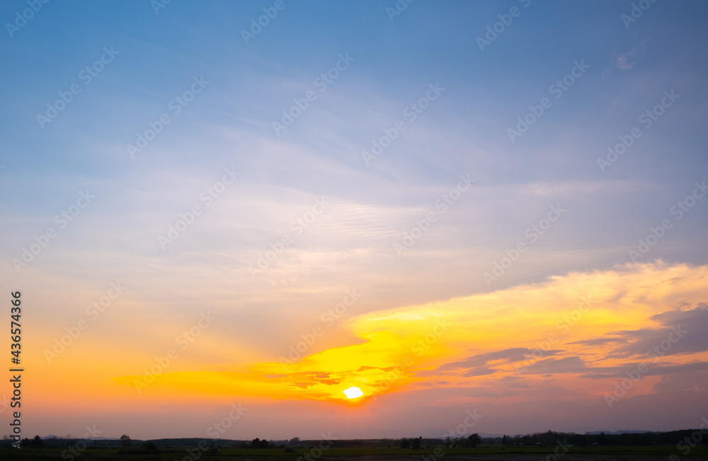 Colorful sunset and sunrise with clouds. Blue and orange color of nature. Many white clouds in the blue sky. The weather is clear today. sunset in the clouds. The sky is twilight. Colorful sunset and sunrise with clouds. Blue and orange color of nature. Many white clouds in the blue sky. The weather is clear today. sunset in the clouds. The sky is twilight.