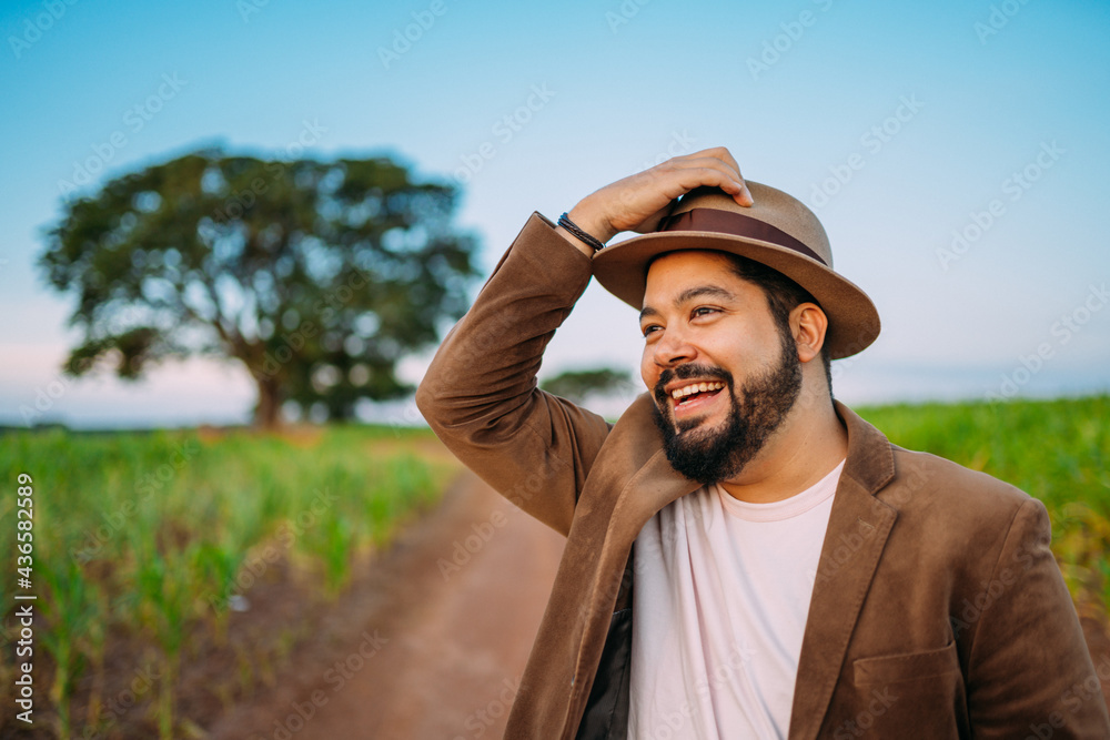 Obraz premium Farmer on the harvest. Sugar Cane plantation. Brazilian farm.