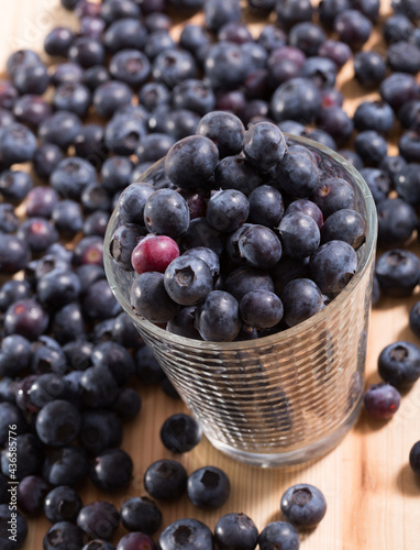 Close up of fresh blueberries on wooden background