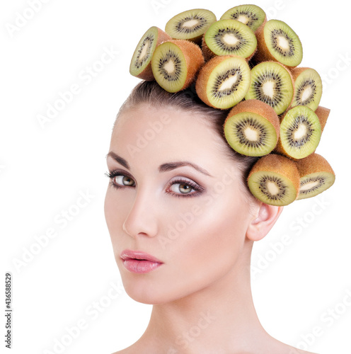 Beautiful woman with hairstyle made ​​from fresh kiwi