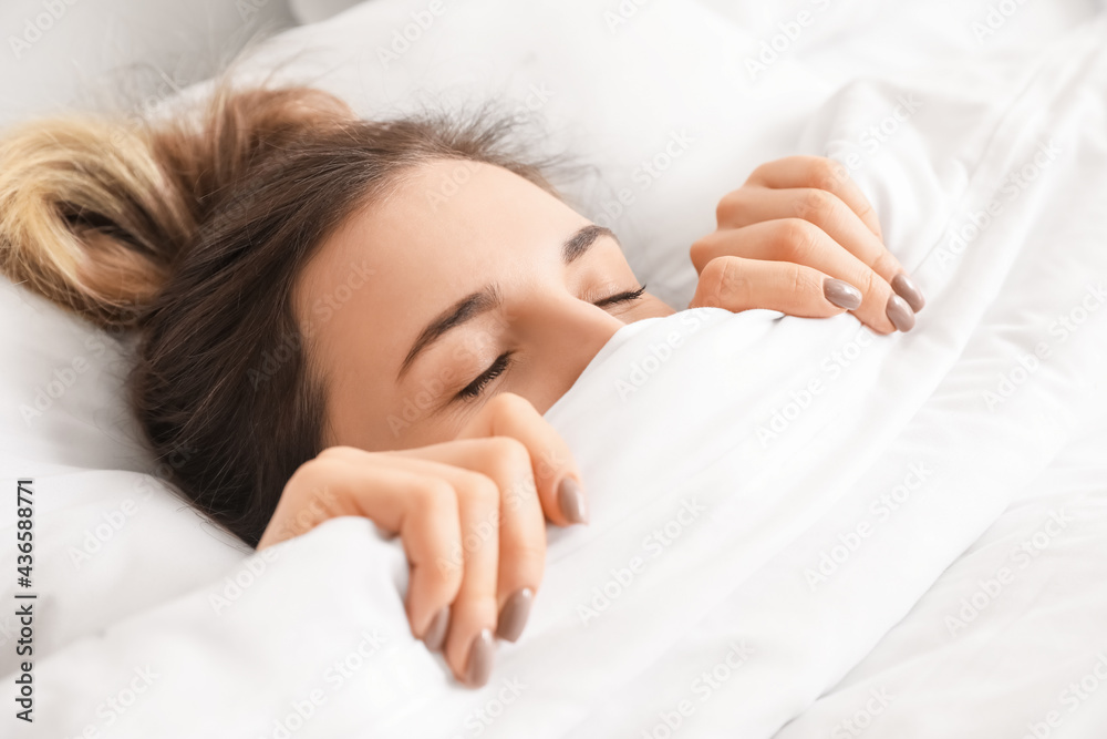 Morning of beautiful young woman sleeping in bed, closeup Morning of beautiful young woman sleeping in bed, closeup