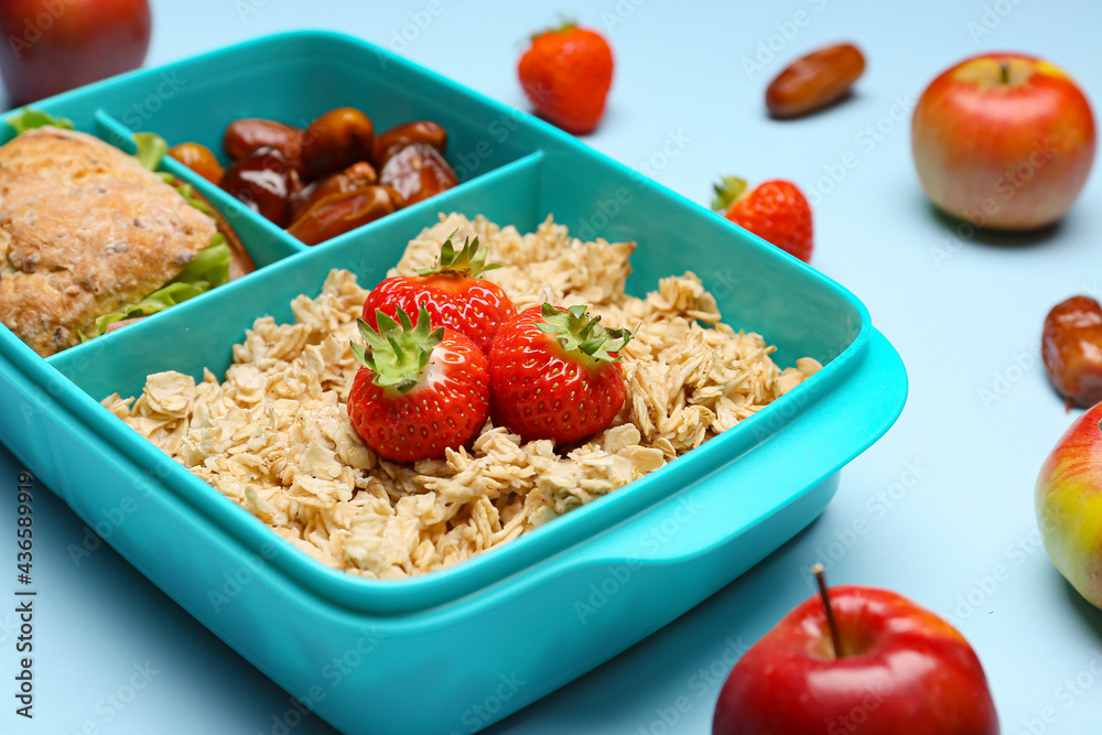 Lunchbox with tasty food on color background Lunchbox with tasty food on color background