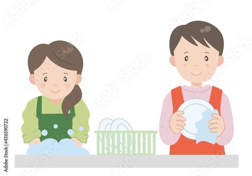 協力して食後の後片付けをする夫婦