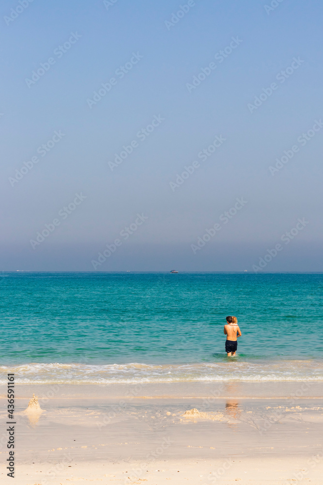 Teenage boy carrying little girl at the beach. Holiday Teenage boy carrying little girl at the beach. Holiday