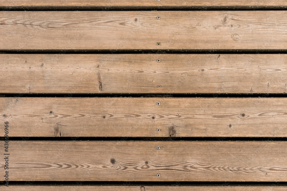 Old rustic light bright wooden texture. Close view of wooden plank table.