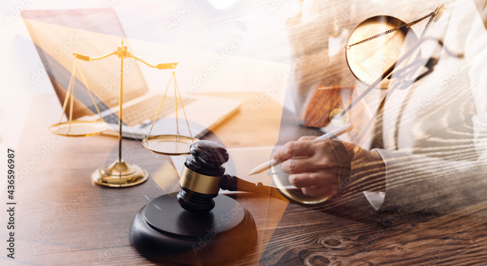 justice and law concept.Male judge in a courtroom on wooden table and Counselor or Male lawyer working in office. Legal law, advice and justice concept. justice and law concept.Male judge in a courtroom on wooden table and Counselor or Male lawyer working in office. Legal law, advice and justice concept.
