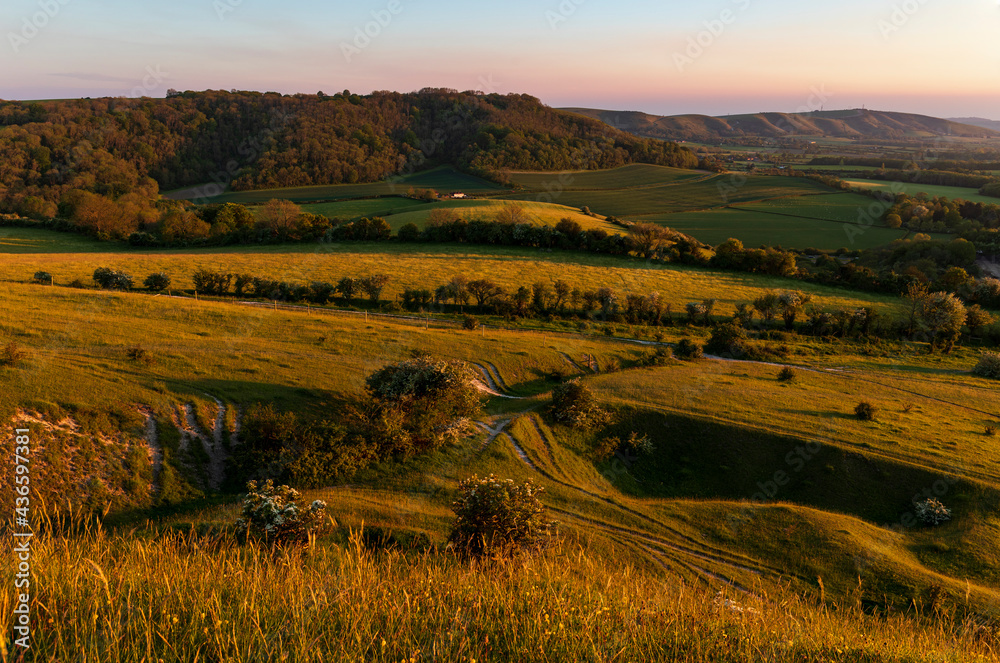 Fototapeta premium Evening golden hour from the top of Wolstonbury Hill South Downs West Sussex, south east England UK