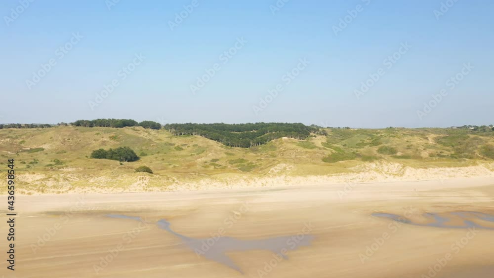 La potiniere beach and its sand dunes in Europe, France, Normandy, Manche, in spring, on a sunny day.
