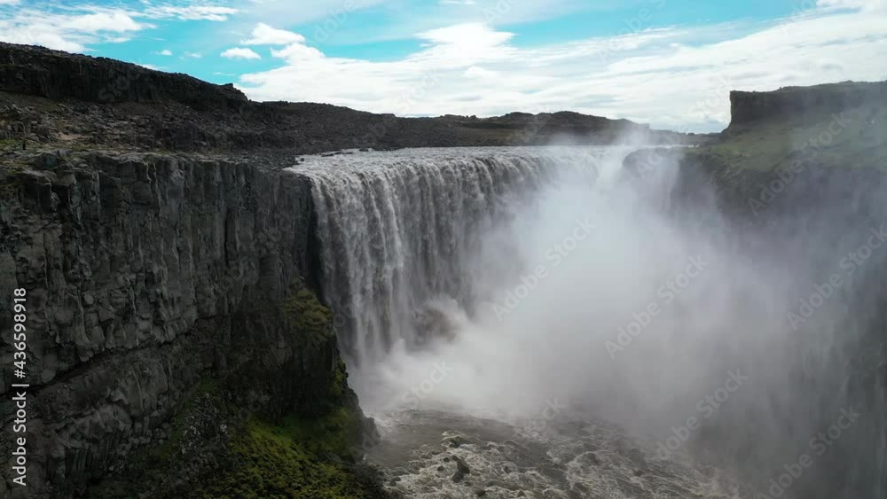Dettifoss Waterfall In Jokulsa a Fjollum River In The Countryside Of North Iceland - aerial drone shot Dettifoss Waterfall In Jokulsa a Fjollum River In The Countryside Of North Iceland - aerial drone shot