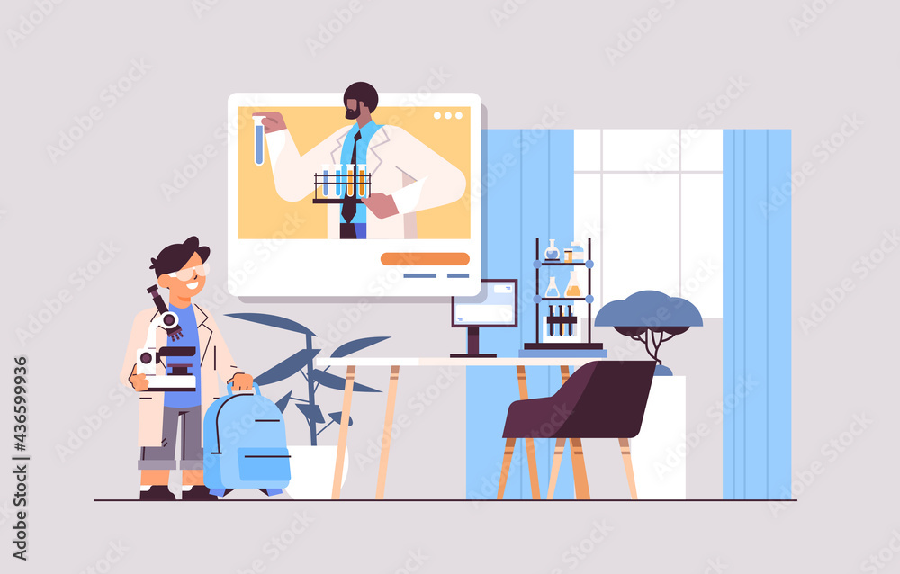 Fototapeta premium schoolboy making chemical experiment with teacher in web browser window during video call self isolation