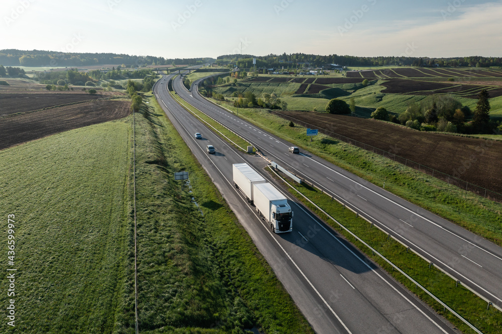 Trailer truck on a highway delivering cargo in Finland.