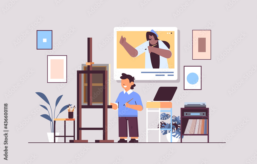 schoolboy with female teacher artist in web browser window painting picture during video call self isolation concept schoolboy with female teacher artist in web browser window painting picture during video call self isolation concept