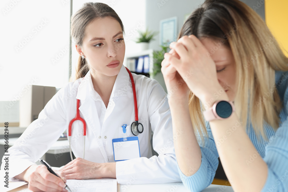Upset and depressed woman at doctor appointment Upset and depressed woman at doctor appointment