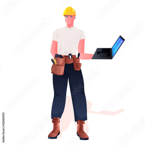 workman in uniform construction worker using laptop full length