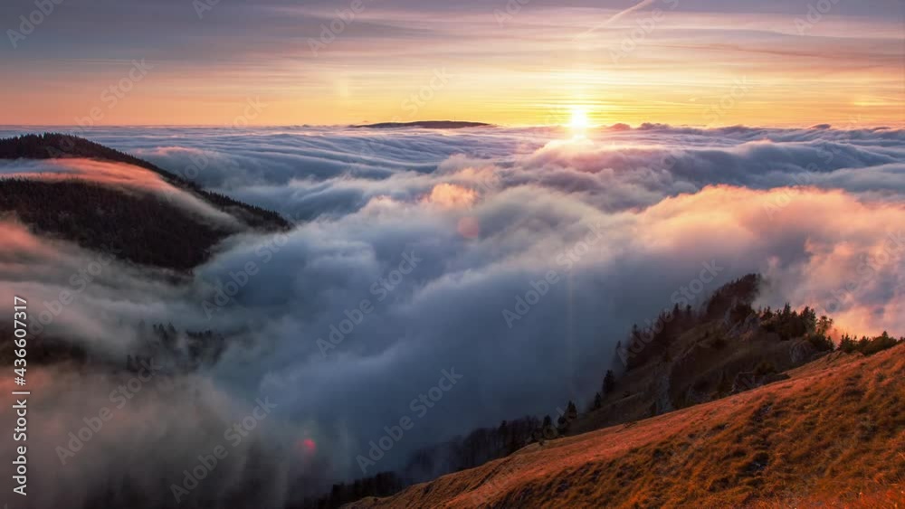 Sunset in autumn mountains above the clouds during the weather inversion in Slovakia. Time lapse landscape.