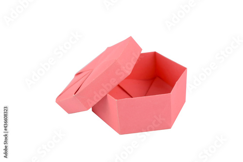 Person holding a lid of a hand made paper crafted gift box of pink color