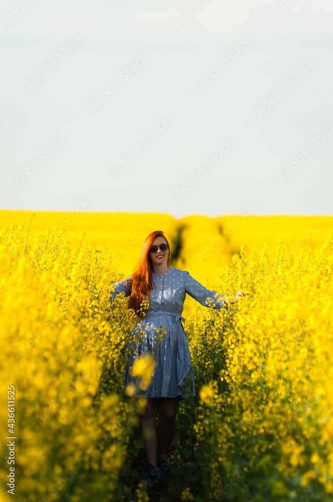 Beautiful pregnant woman portrait on the agriculture field