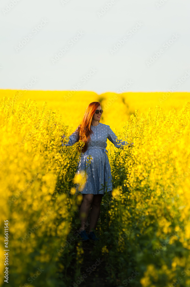 Beautiful pregnant woman portrait on the agriculture field