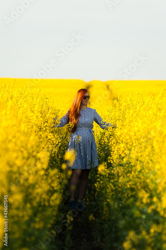 Beautiful pregnant woman portrait on the agriculture field © alipko