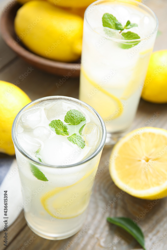 Glasses of cold lemonade on wooden table, above view Glasses of cold lemonade on wooden table, above view